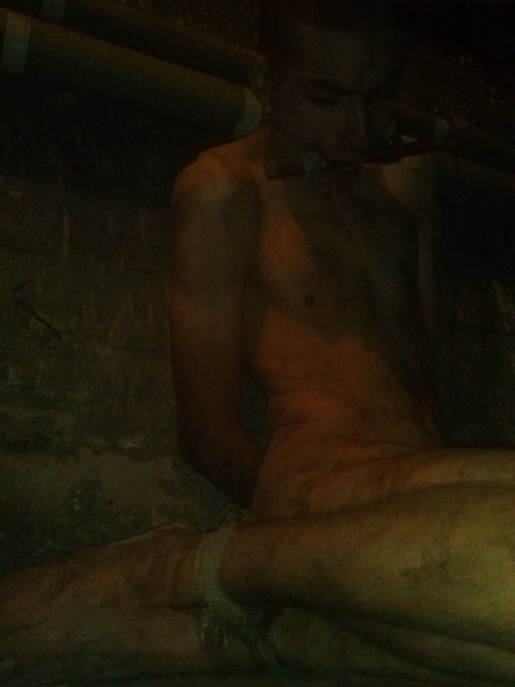Young slave in dirty cellar